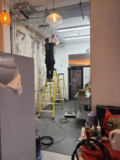 working at height to install fixtures at the edge